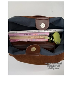 Internal view of brown suede tote bag showing large capacity and magnetic closure