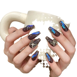 Dark cocoa brown long coffin press-on nails with blue aurora cat-eye and silver 3D butterflies