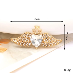 Golden angel wing heart crown jewelry piece with clear gemstone and micro rhinestones