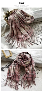 Detail of pink and white plaid scarf with soft fringe texture and woven cashmere-like fabric