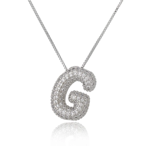 Macro shot of silver letter G pendant with micro-paved cubic zirconia on box chain