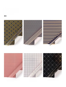 Showcase of six geometric gift wrapping paper patterns including gold and black hexagons