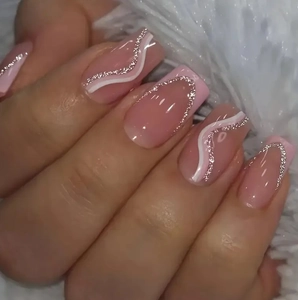 Pink and silver glitter french press-on nails with white wavy lines on white fur