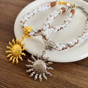 Ethnic woven sun pendant necklace in gold and silver finish with bohemian style
