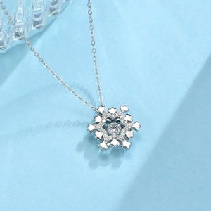Macro detail of snowflake pendant with dancing zircon stone in S925 sterling silver