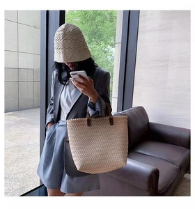 Straw woven tote bag and sun hat set in beige for summer vacation fashion styling