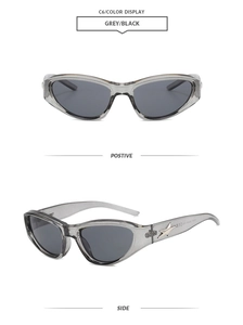 Detail showing grey transparent Y2K sunglasses with star metal decoration on side temples