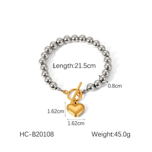 Detail of beaded bracelet with gold T-bar closure and heart pendant measurement details