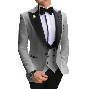Detailed close-up of a premium three-piece men suit with double-breasted vest and peak lapel