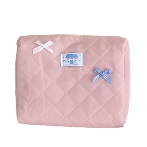 Pink quilted bow makeup bag with macaron colors and a soft cotton portable design