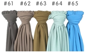 Detail view of five solid color pearl chiffon scarves showing fabric texture and drape