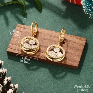 Golden heart tassel earrings with crystals on wooden stand, 3.0cm height and 4.5g weight