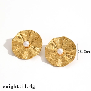 Irregular vintage golden flower earrings with white pearl centers and metal texture