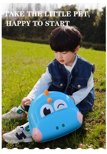 Blue hard shell dinosaur backpack for toddlers worn by a boy in an outdoor setting