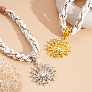Handwoven rope necklace with sun pendant in gold and silver finish on stones