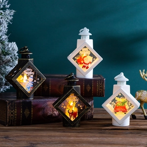 Close-up of vintage bronze and white Christmas LED lanterns on festive tabletop decor