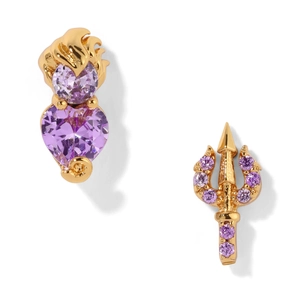 Close-up of asymmetrical gold earrings with purple heart crystal and trident design