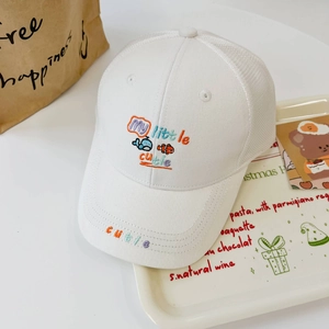 Close-up of kids white mesh baseball cap with My Little Cutie whale embroidery