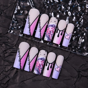 Gothic Halloween press-on nails with pink purple gradient and creepy graffiti art