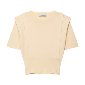 Pale yellow short sleeve knit crop top with padded shoulders and ribbed crew neck design