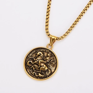Detail of a gold Saint George round pendant with box chain on a white background