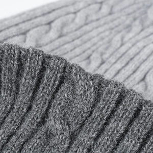 Chunky knit beanie featuring classic cable pattern and thick grey ribbed texture for winter
