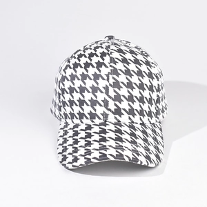 Macro detail of high-quality black and white houndstooth pattern on a baseball cap