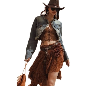 Vintage western cowboy blue denim jacket with studs and fringe details on white background