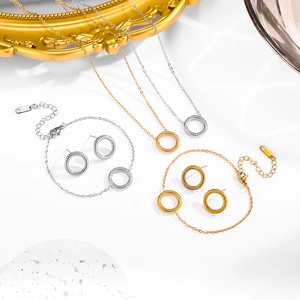 Retro stainless steel jewelry set with textured circles in gold and silver finish