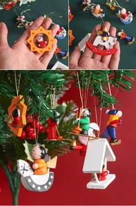 Detail of hand-painted wooden Christmas ornaments including rocking horse and small figures