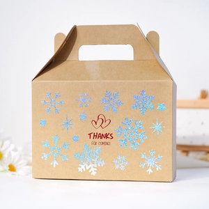 Brown kraft paper gift box featuring a glittery blue snowflake and a festive thank you message