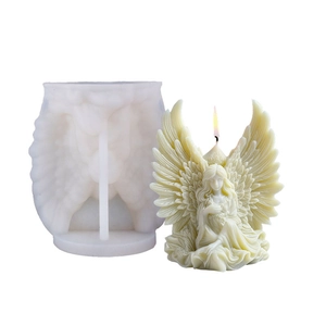 3D Angel Wings silicone mold with finished praying angel candle on white background