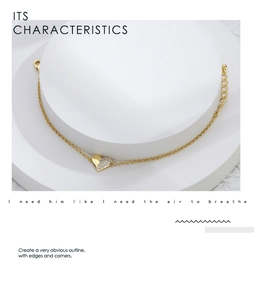 Detail of gold heart bracelet with micro-pave white zircons and adjustable lobster clasp