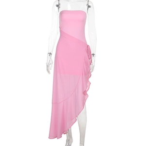 Detail of pink strapless wrap dress featuring ruffled hem and side tie design