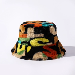Close-up of fluffy faux fur texture and vibrant graffiti letter print on a bucket hat