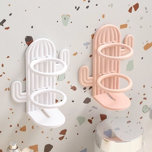 Wall-mounted cactus toothbrush holder in white and pink matte finish for bathroom