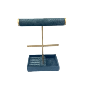 Velvet jewelry display stand organizer with golden metal frame and earring rack