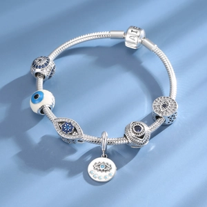 Detailed view of S925 sterling silver evil eye beads with blue crystals on a bracelet