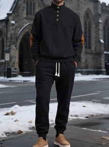 Detail of men's knit set with diamond texture, brown elbow patches and button collar
