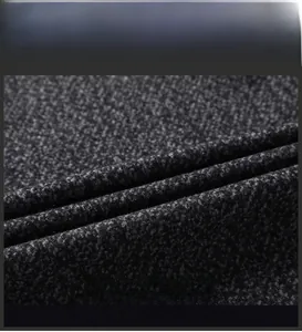Close-up of premium dark grey wool blend fabric showing thick texture and weave detail
