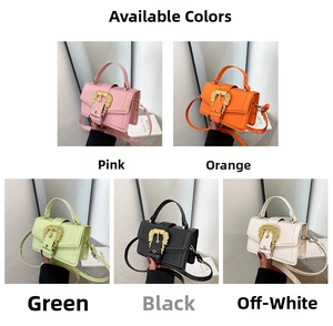 Detail view of stylish crossbody handbags in pink, orange, green, black and cream with gold buckles