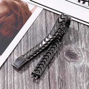 Vintage dragon bone chain bracelet for men in antique silver finish on wood background