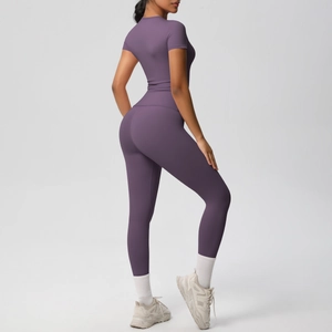 Detail view of high-waist purple yoga leggings with seamless sculpting effect