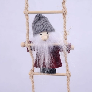 Detail of wool felt Christmas elf climbing a rope ladder with wooden rungs for festive decor