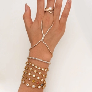 Golden stainless steel bracelet set featuring heart charms and sparkling zircon stones