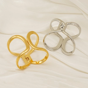 Minimalist geometric adjustable metal bracelet in polished gold and silver finish