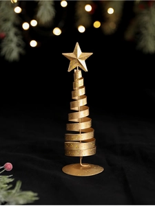 Close-up of golden spiral metal Christmas tree with star topper and glitter detail