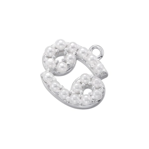 Detailed view of silver letter B charm inlaid with white pearls for DIY jewelry