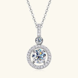 Detail of S925 sterling silver necklace with a brilliant round moissanite pendant