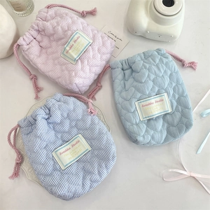 Quilted heart drawstring camera pouch for outdoor storage in pink and blue fabric